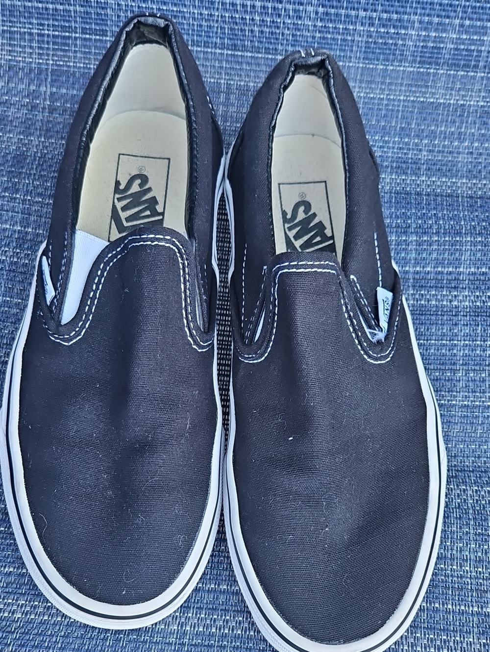 Vans Slip-On Canvas Sneakers in Black and White